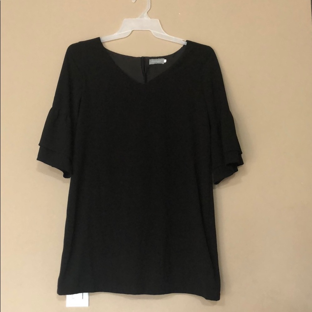 Black dress with mid length ruffles sleeves.